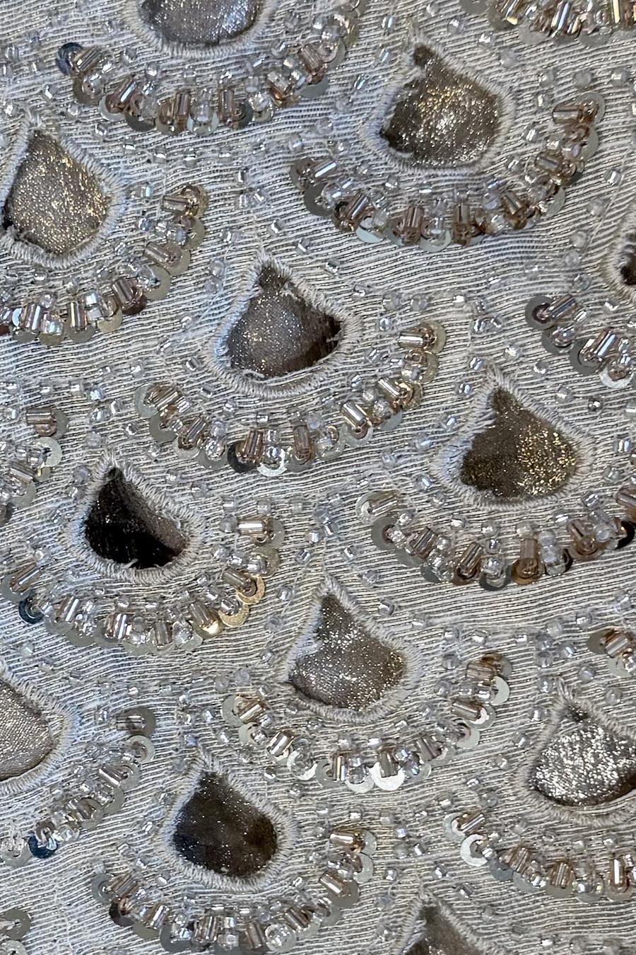 Silver mirror cutwork shirt, close up of the sequin rimmed scallop cutouts