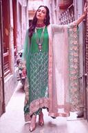 Teal sequin long shirt styled with the blush satin dupatta over one arm, full length view