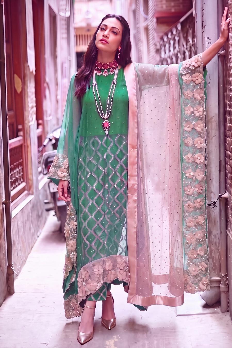 Teal sequin long shirt styled with the blush satin dupatta over one arm, full length view